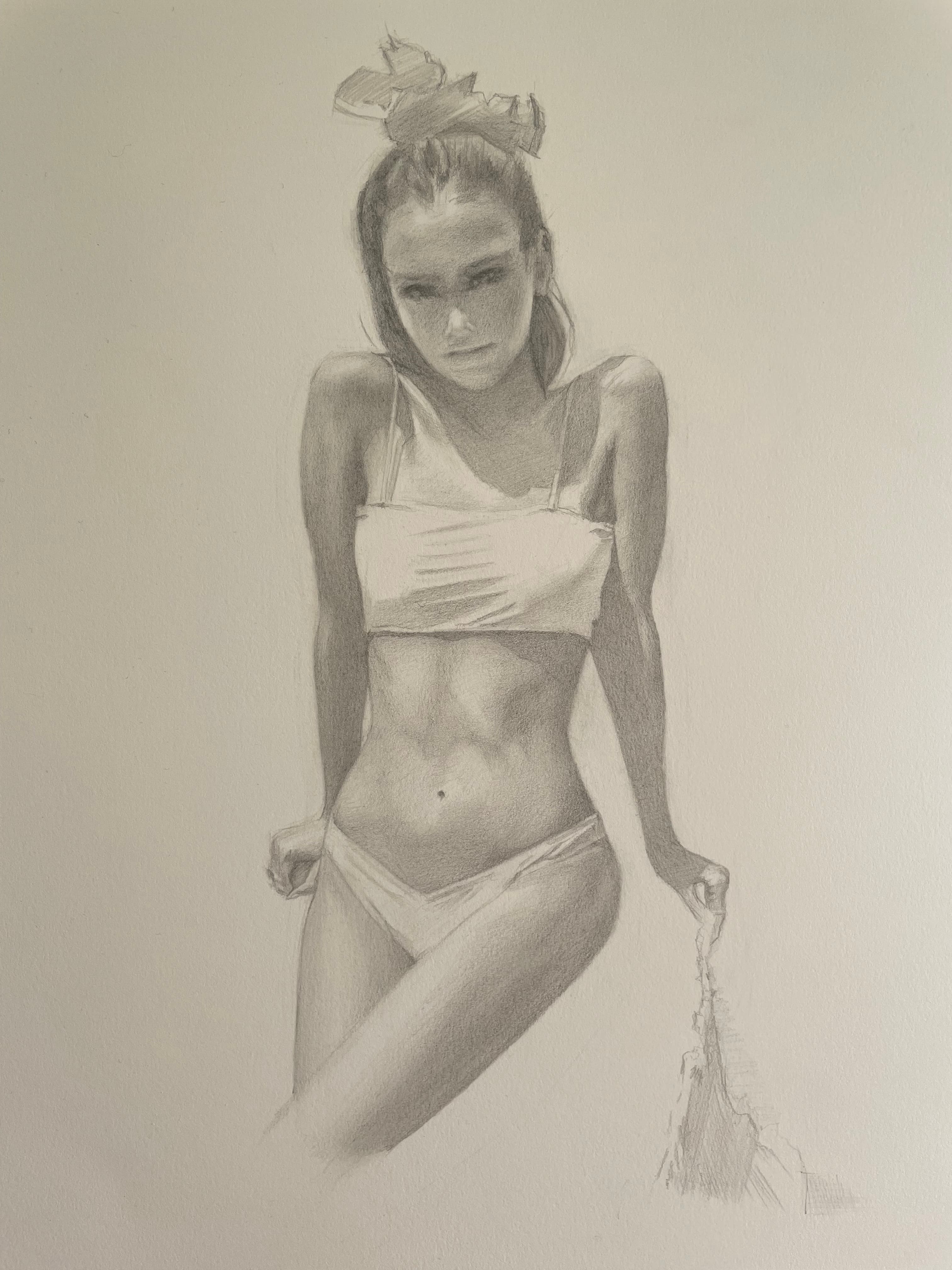 Girl resting against cabinets